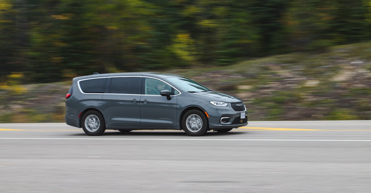 Modern minivan on a scenic highway — Renault Scenic inertia switch location and reset guide for Mk1 to Mk4