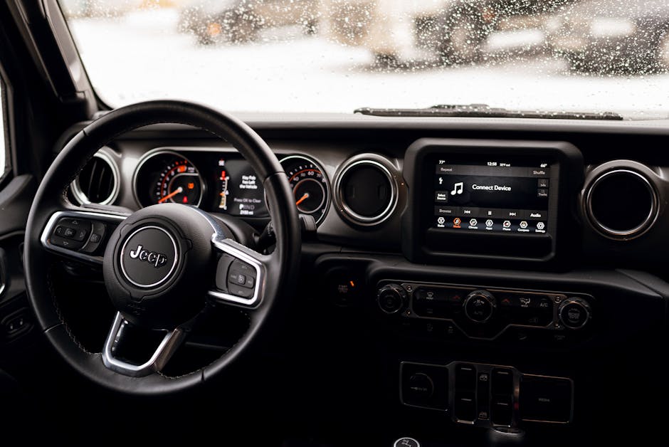 Jeep Renegade interior dashboard and center console — under-seat storage on European models