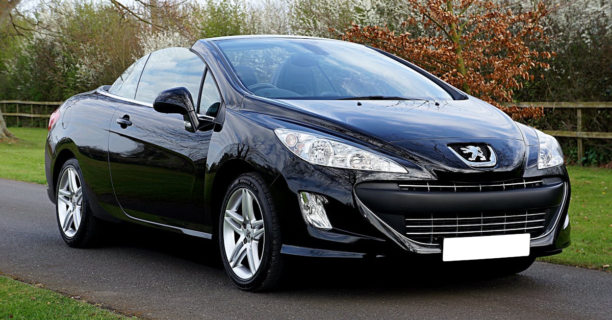 Black Peugeot 308 on a countryside road — inertia switch location and reset guide for Mk1/Mk2
