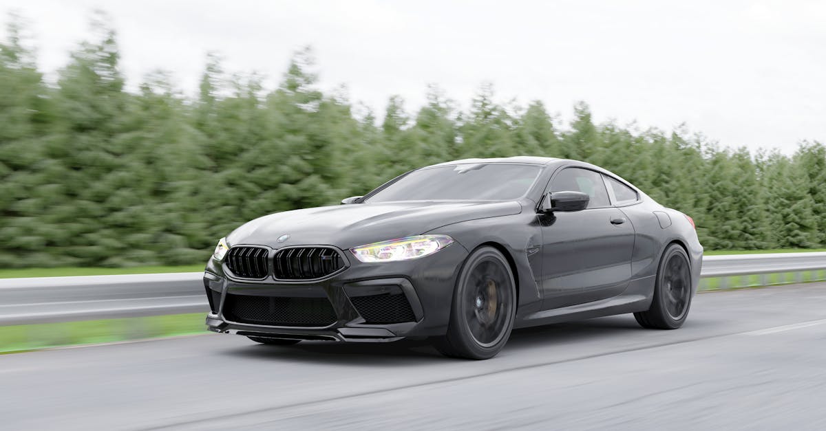 Black BMW driving on scenic highway — why BMW does not have a mechanical inertia switch