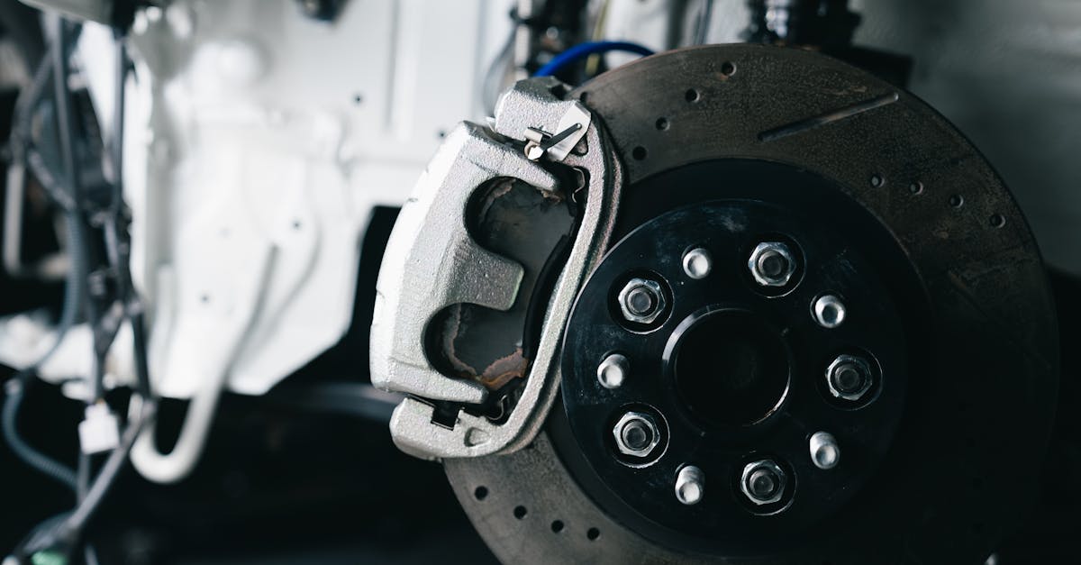 Close-up of car brake caliper and disc — C0035 front wheel speed sensor diagnosis and replacement